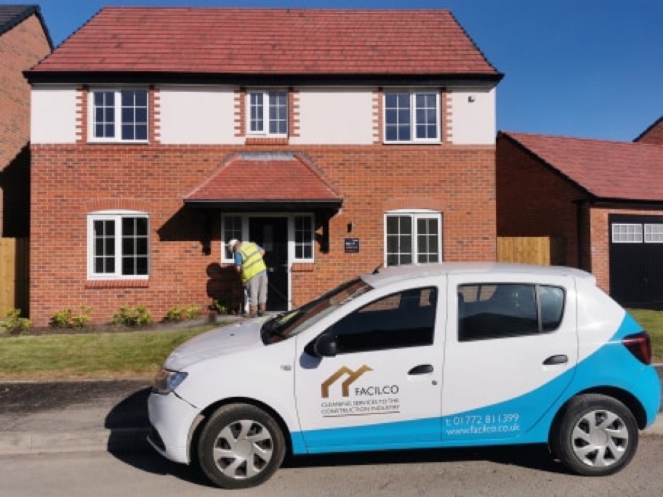 Facilco car in front of a newly built house