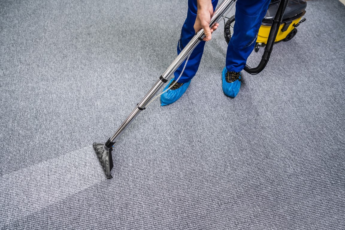 Commercial cleaner cleaning a carpet