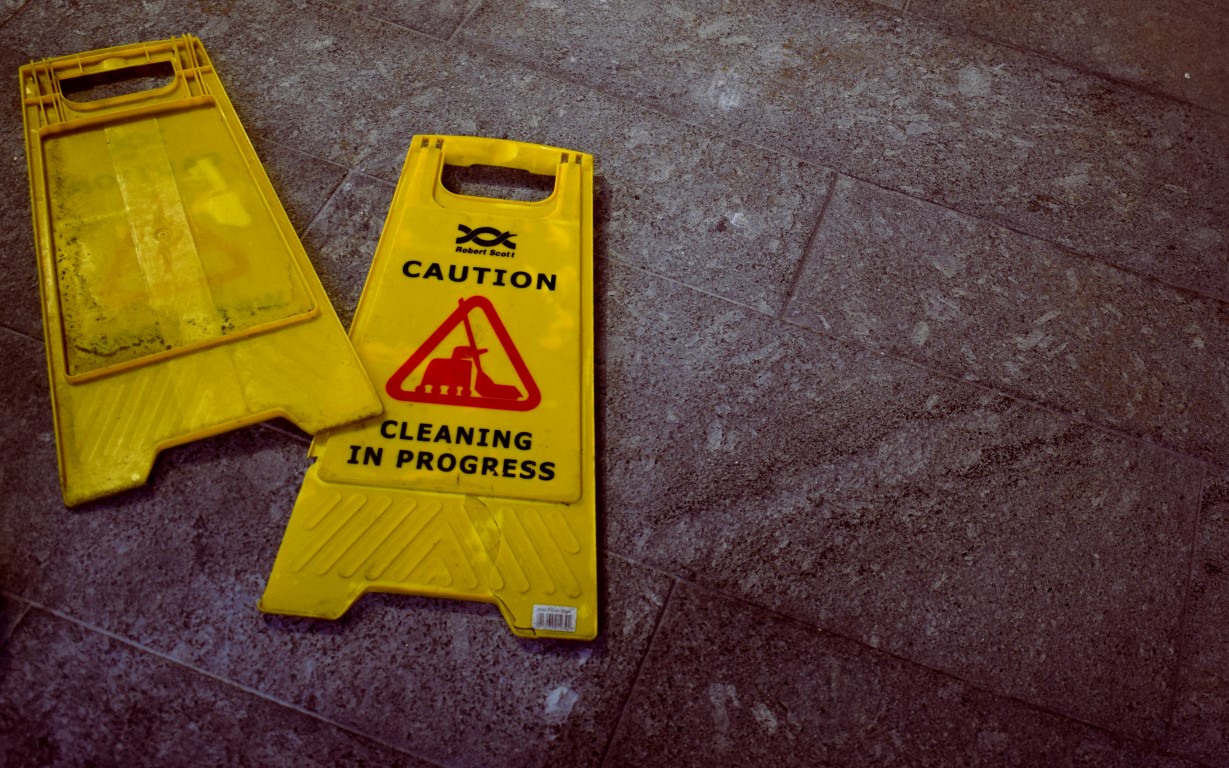 Caution - cleaning in progress signs on the floor