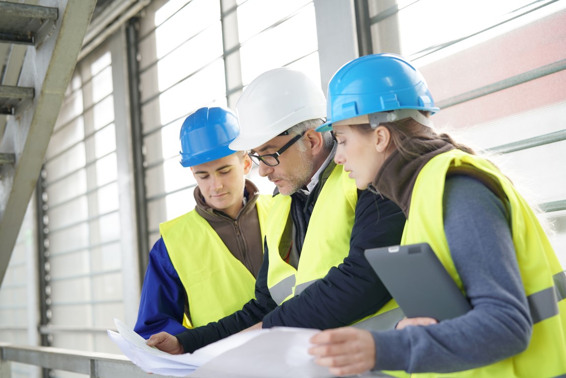 Construction manager discusses health and safety with his team